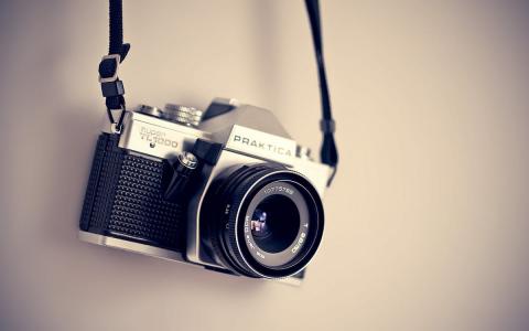 Camera hanging from a wall
